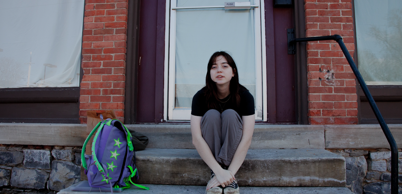 Elliana Polyak sitting on brick steps