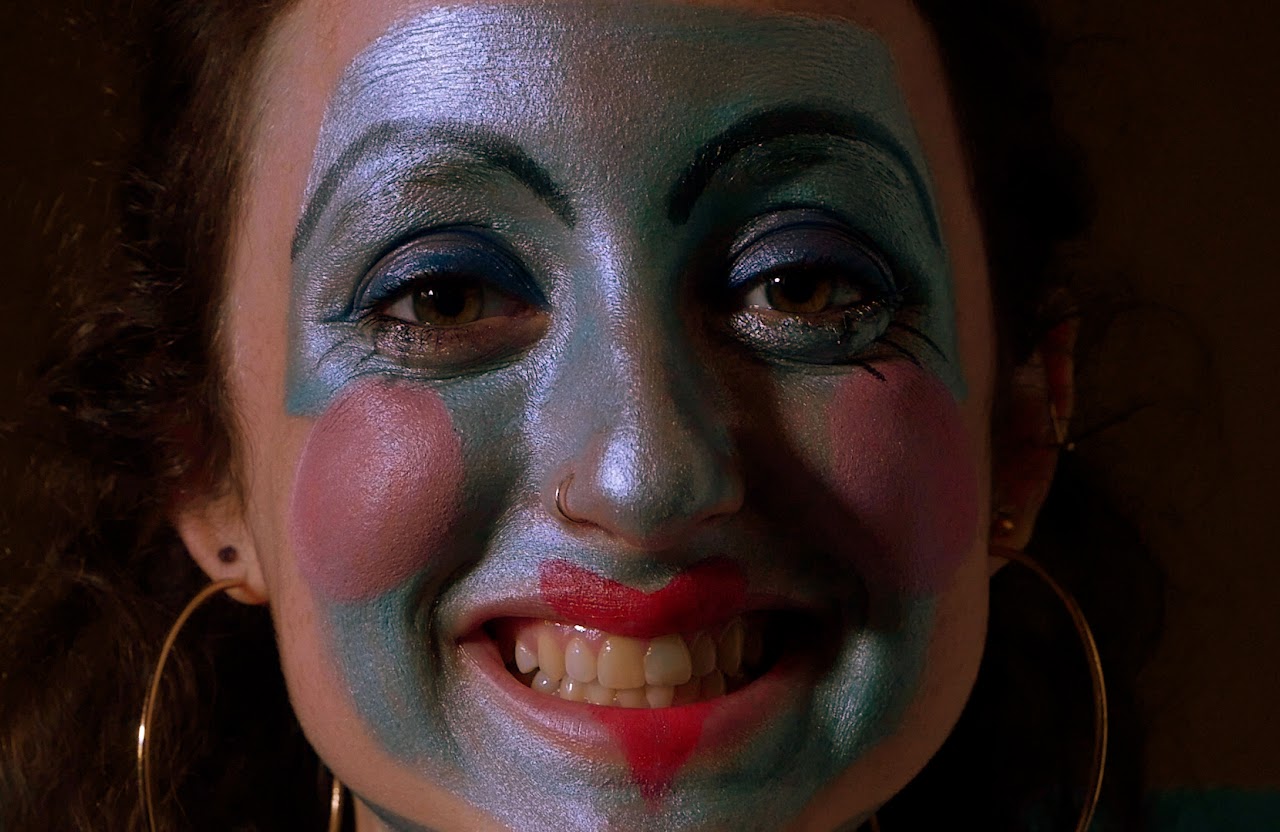 Close-up film still of theatrical face paint